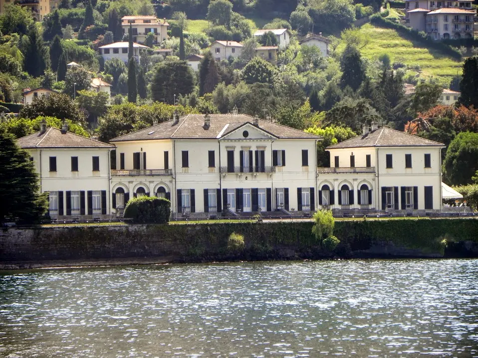 Villa Melzi — the neoclassical lakeside villa in Bellagio, set behind a stone seawall on Lake Como.